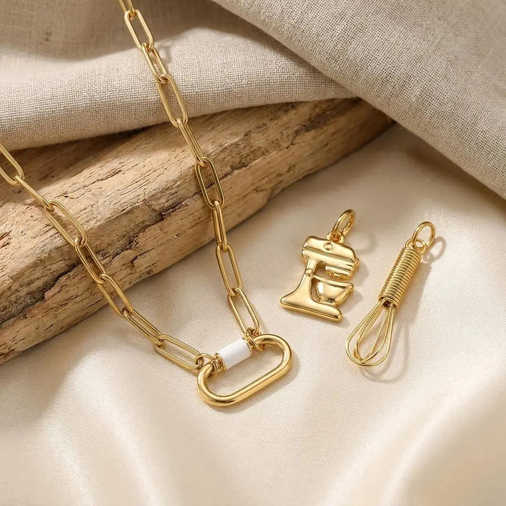 18K gold PVD stainless steel whisk charm jewelry by Winks Design Studio, LLC featuring a detailed whisk design.