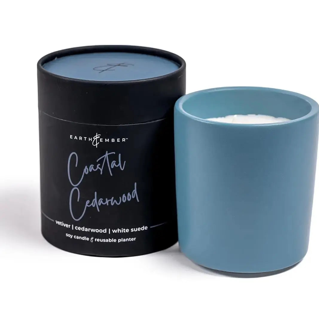 Earth & Ember 13 oz Coastal Cedarwood candle by Winks Design Studio, LLC, showcasing a rustic candle with a wooden wick and coastal scent.