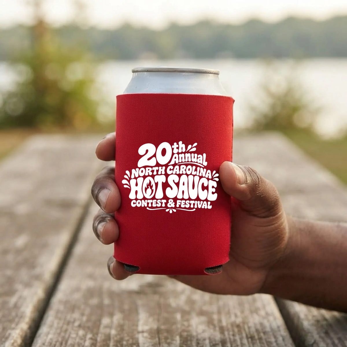 Winks Design Studio LLC NC Hot Sauce Festival bubble letter can cooler koozie in bright colors, designed to keep drinks cold.