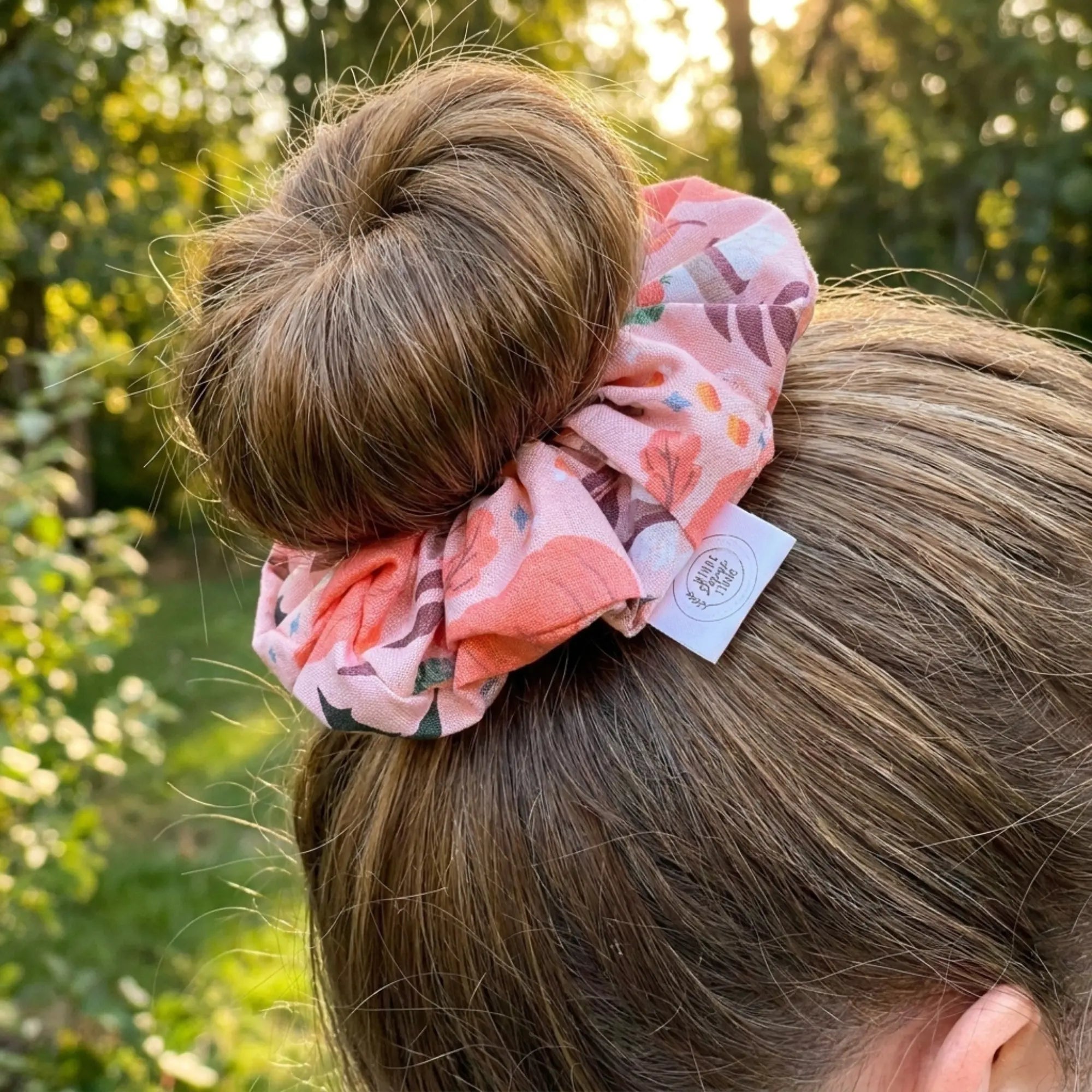 Pumpkin Patch fall-themed scrunchie by Winks Design Studio, LLC featuring cozy autumn-inspired fabric and pumpkin print.