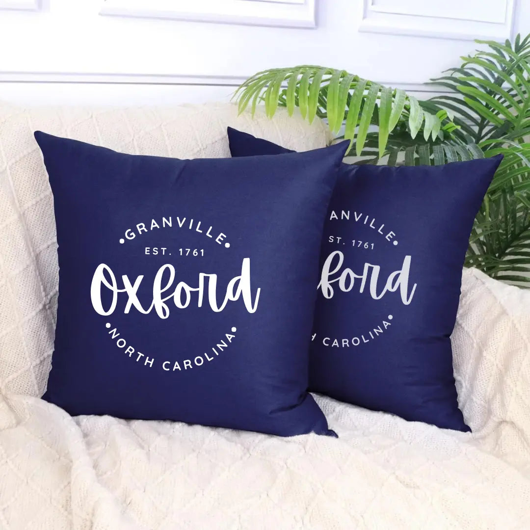 Circular Oxford Pillow by Winks Design Studio, LLC with soft fabric and decorative stitching, perfect for home decor and comfort.