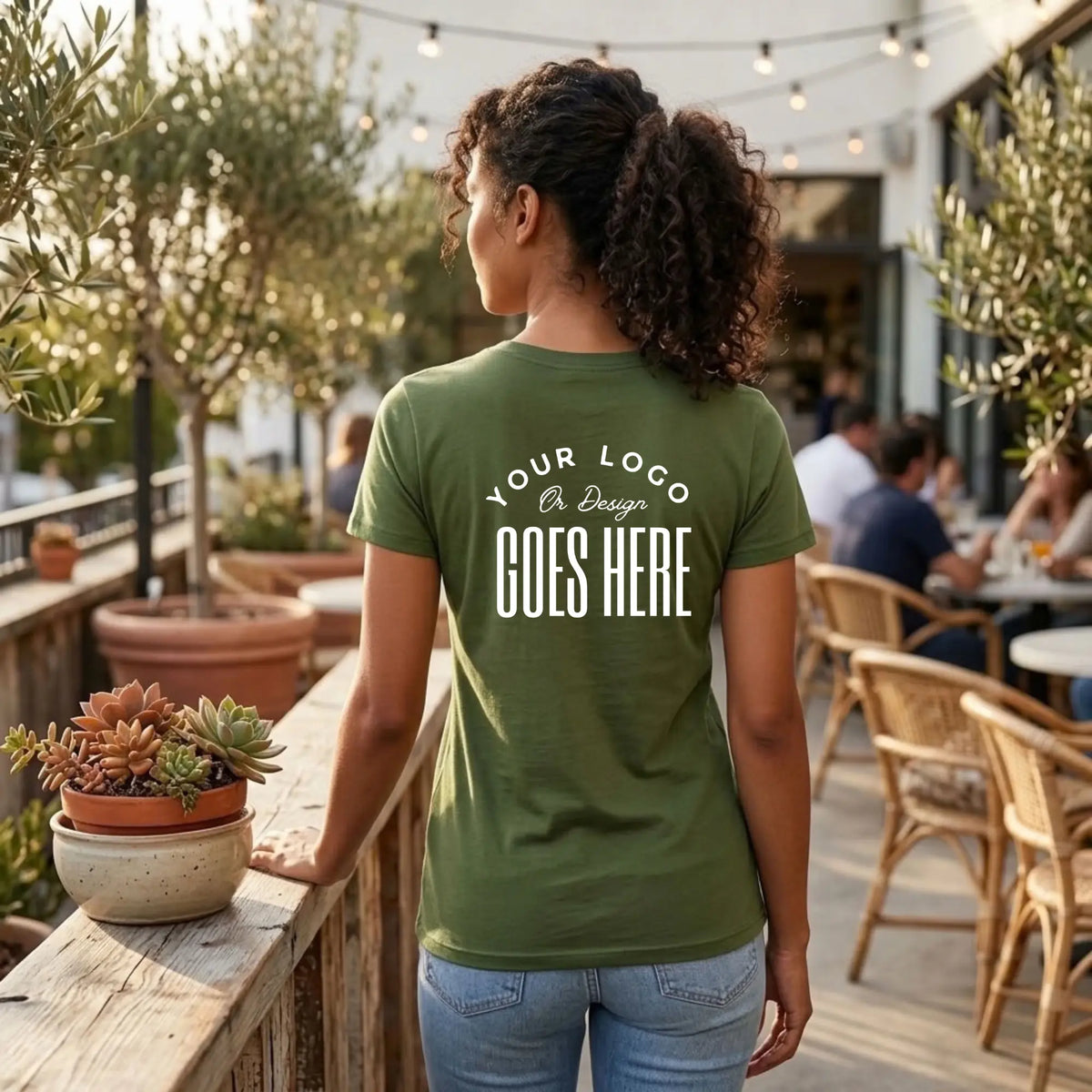 Back view of a military green custom t-shirt with a large white "Your Logo or Design Goes Here" back placeholder print