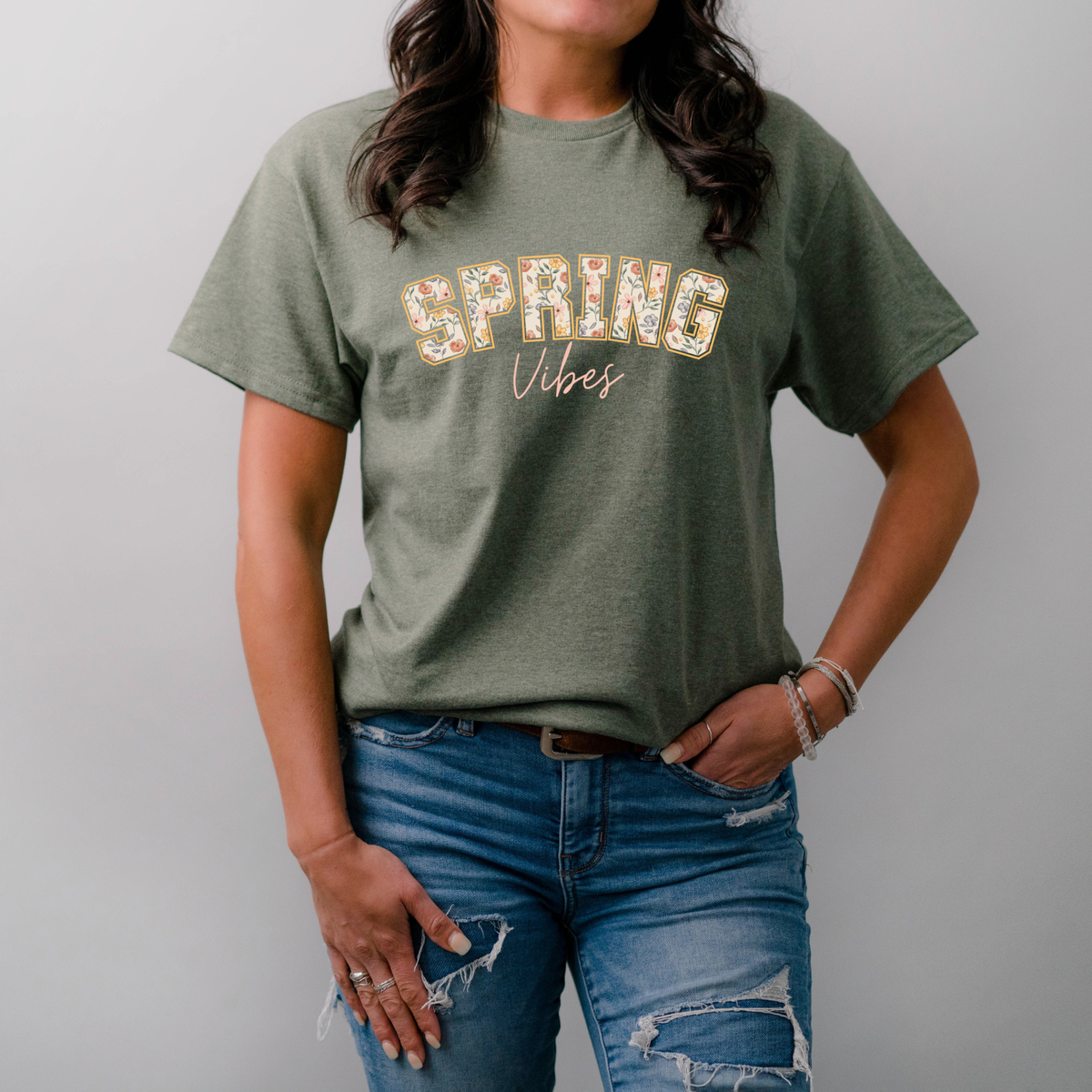 Winks Design Studio floral spring tee featuring colorful flower patterns on soft fabric, casual short-sleeve shirt for women.