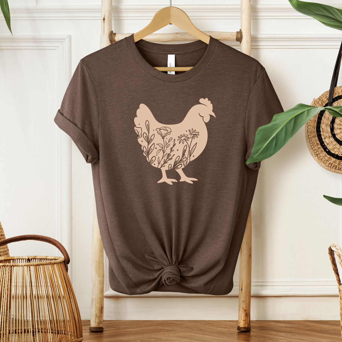 Farmhouse Wildflower Hen Tee by Winks Design Studio, LLC, featuring a casual shirt with a floral hen graphic on soft fabric.