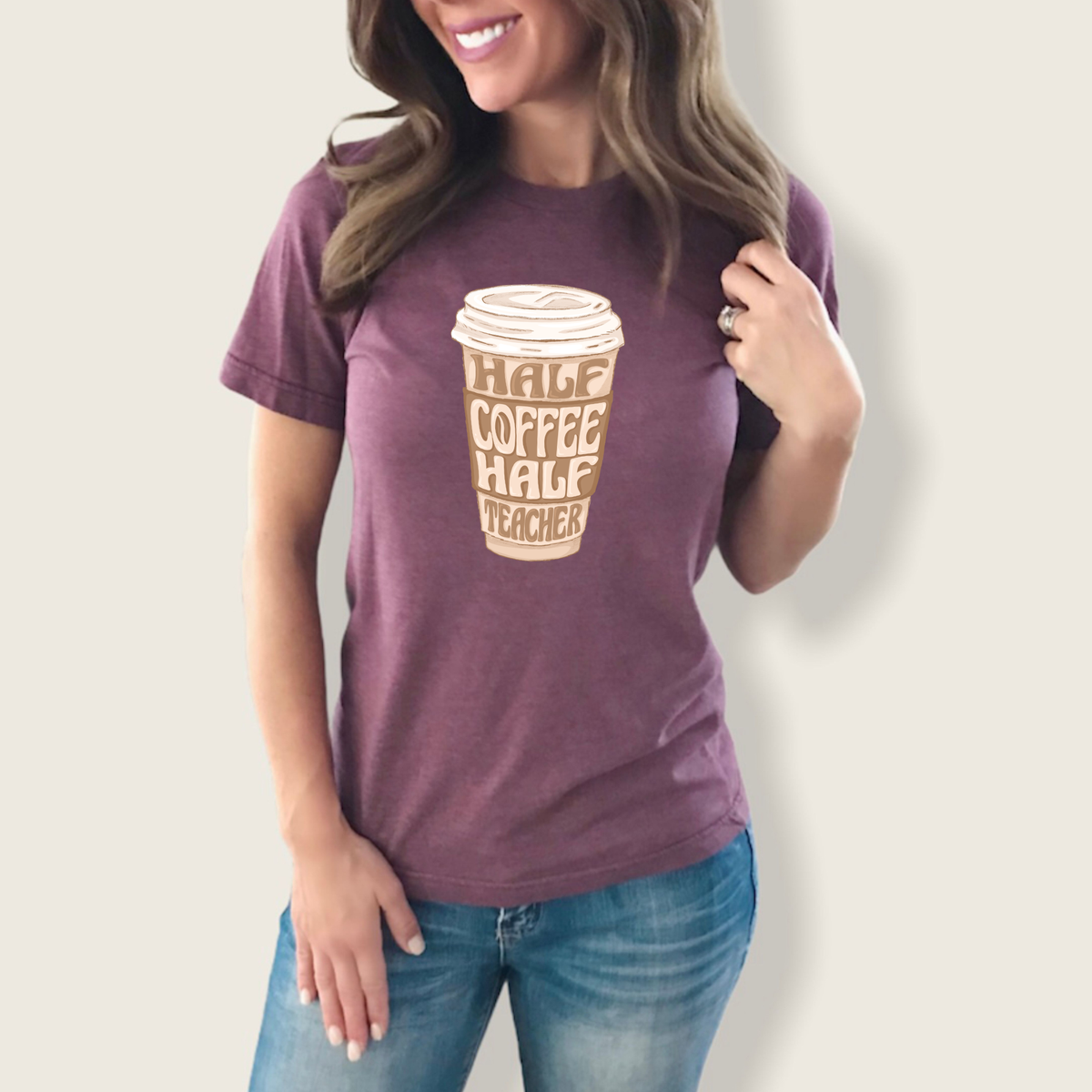 Half coffee, half teacher graphic tee from Winks Design Studio featuring a playful design on a casual shirt.