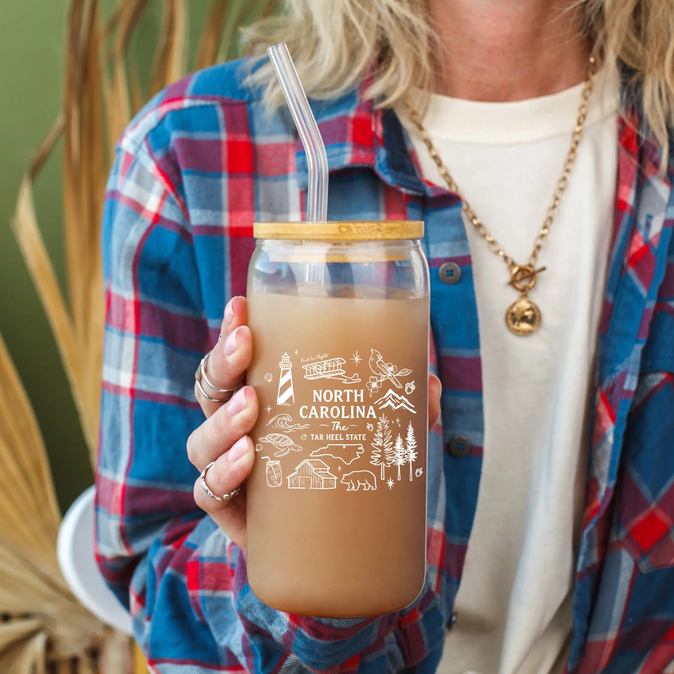 North Carolina State clear glass beer can featuring the Winks Design Studio logo, 20oz capacity, transparent with printed design.