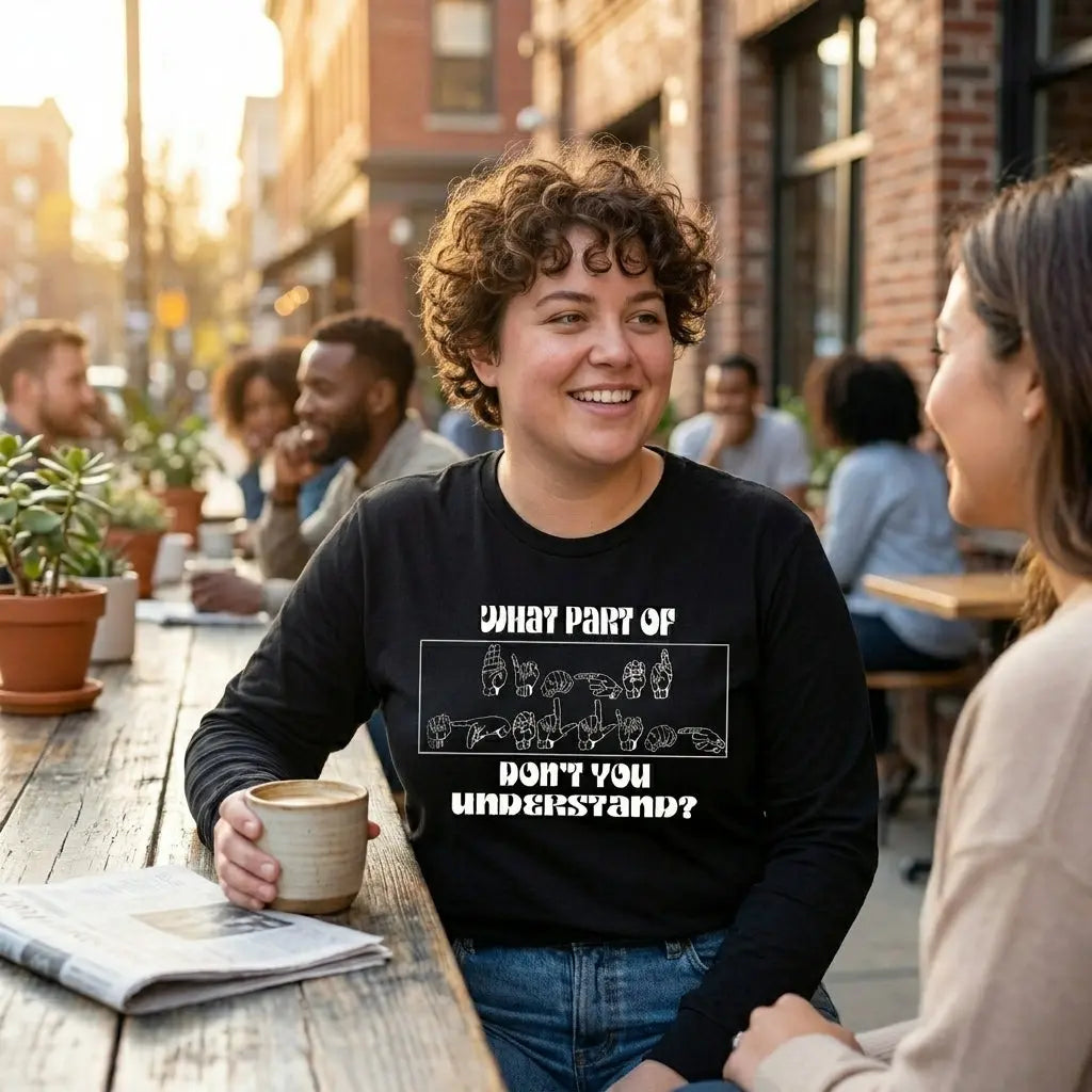 Long sleeve shirt featuring ASL finger spelling design by Winks Design Studio, LLC, shown on a person with the shirt&