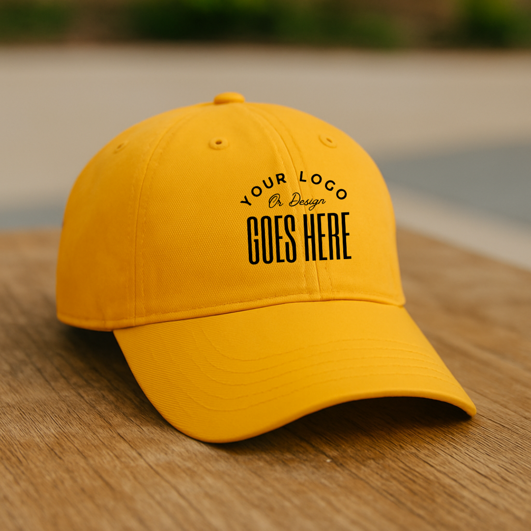 Yellow cap with customizable text on a wooden surface