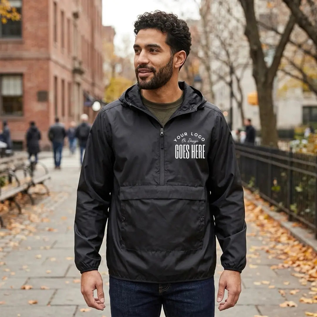 Black custom quarter zip pullover windbreaker with a white "Your Logo or Design Goes Here" left chest placeholder print