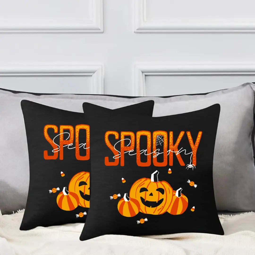 Decorative spooky season pillow with Halloween-themed design from Winks Design Studio, LLC, featuring fall colors and festive patterns.