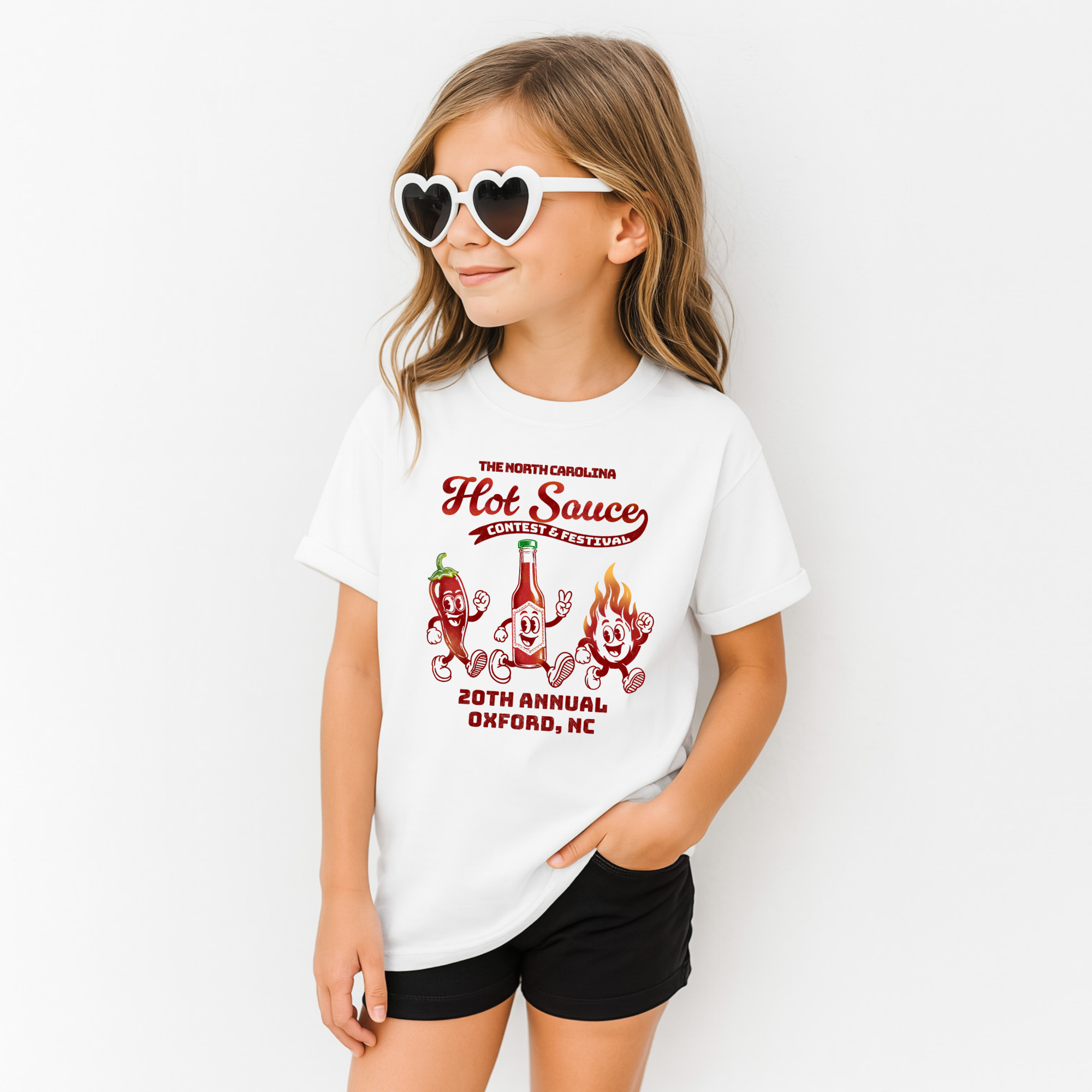 Kids T-shirt featuring retro hot sauce character design by Winks Design Studio, LLC, in bright colors on a casual cotton tee.