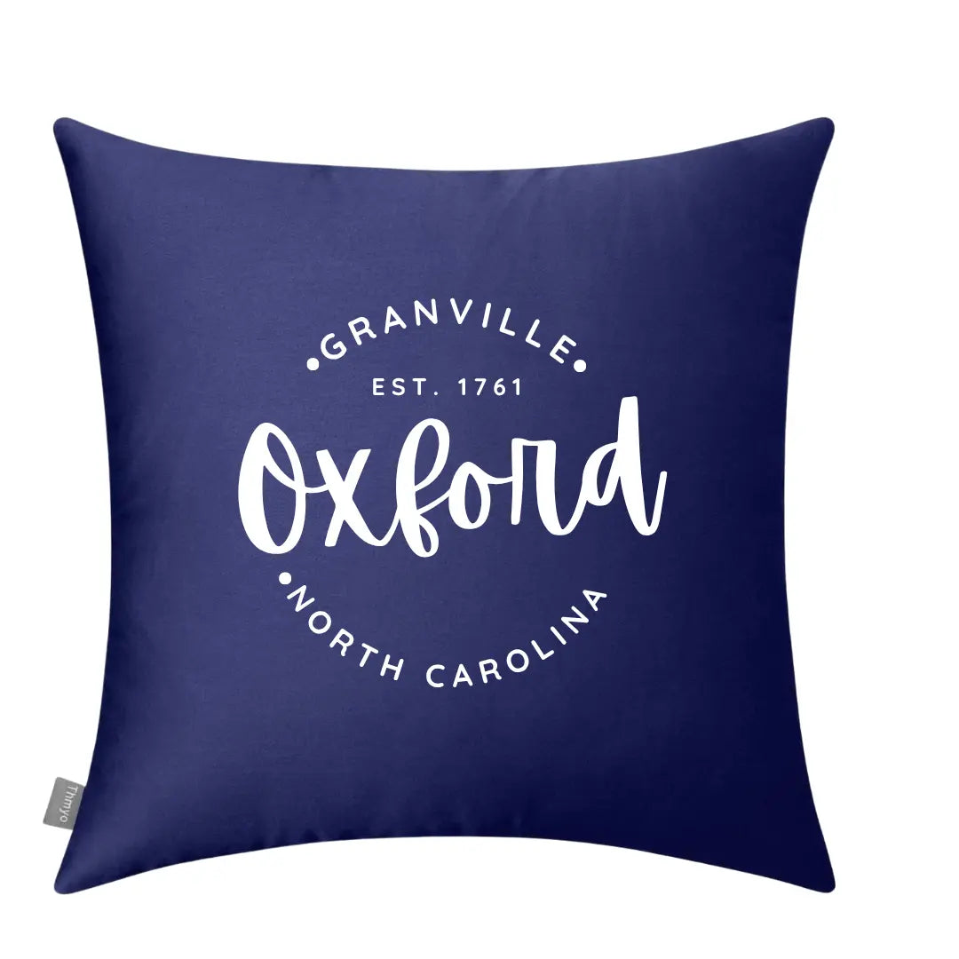Circular Oxford Pillow by Winks Design Studio, LLC featuring a plush, round design with soft fabric and decorative stitching.