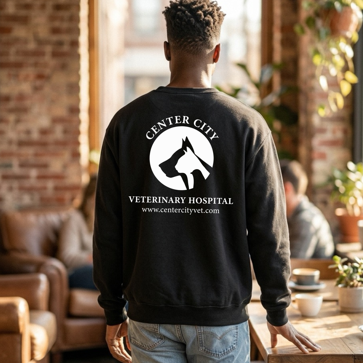 Winks Design Studio Center City Vet crewneck sweatshirt in gray, made of soft fabric with a crewneck collar and long sleeves.