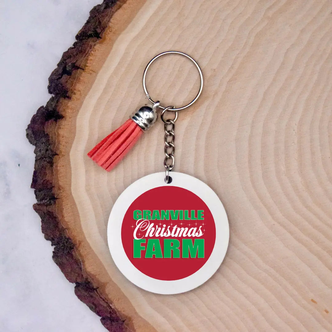 Winks Design Studio LLC Granville Christmas Farm keychain featuring festive holiday farm scene on a small metal keyring