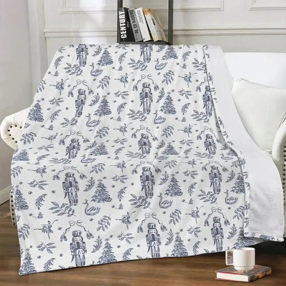 Elegant Nutcracker Christmas blanket by Winks Design Studio, LLC featuring festive nutcracker and holiday-themed cozy fabric.