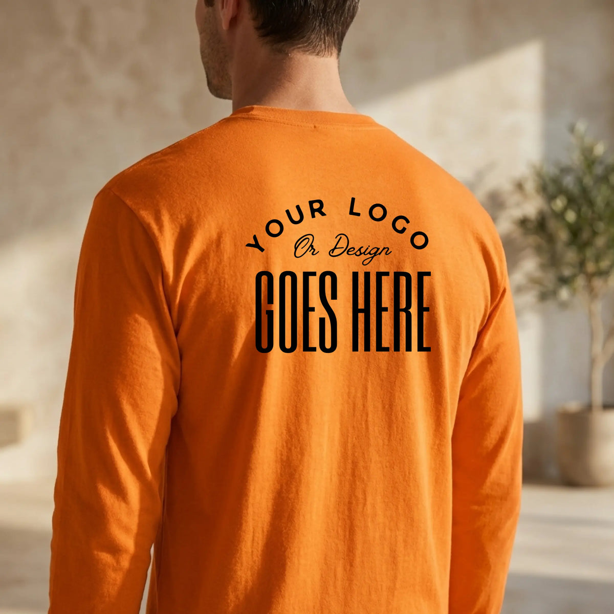 Custom Gildan 50/50 long-sleeve T-shirt with Winks Design Studio branding, showing a comfortable, casual fit and fabric details.