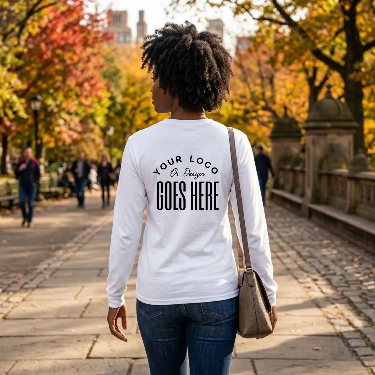 Back view of a white custom long sleeve t-shirt with a large black "Your Logo or Design Goes Here" back placeholder print