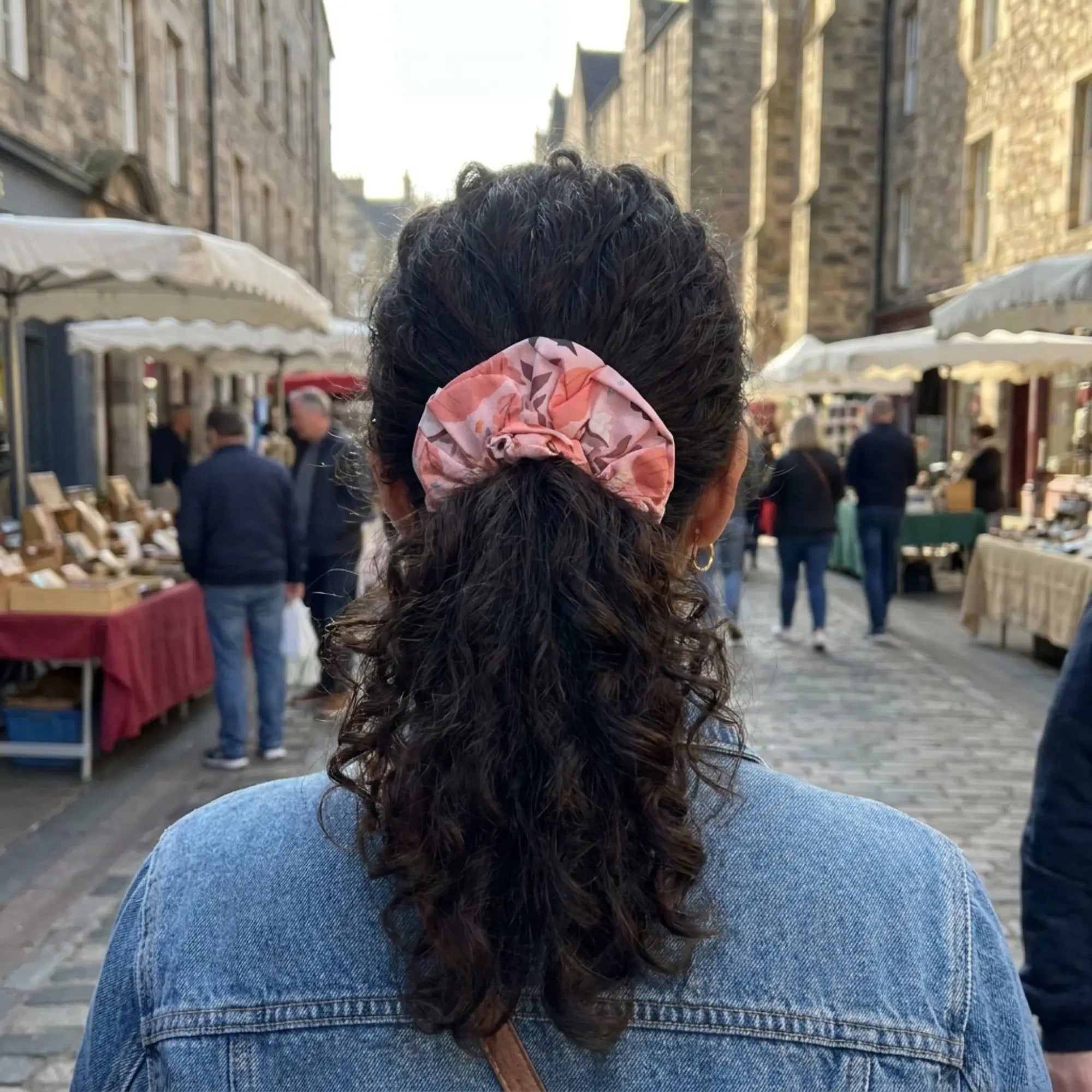 Winks Design Studio LLC pumpkin patch fall-themed scrunchie with orange and brown fabric, cozy hair accessory for autumn styles.
