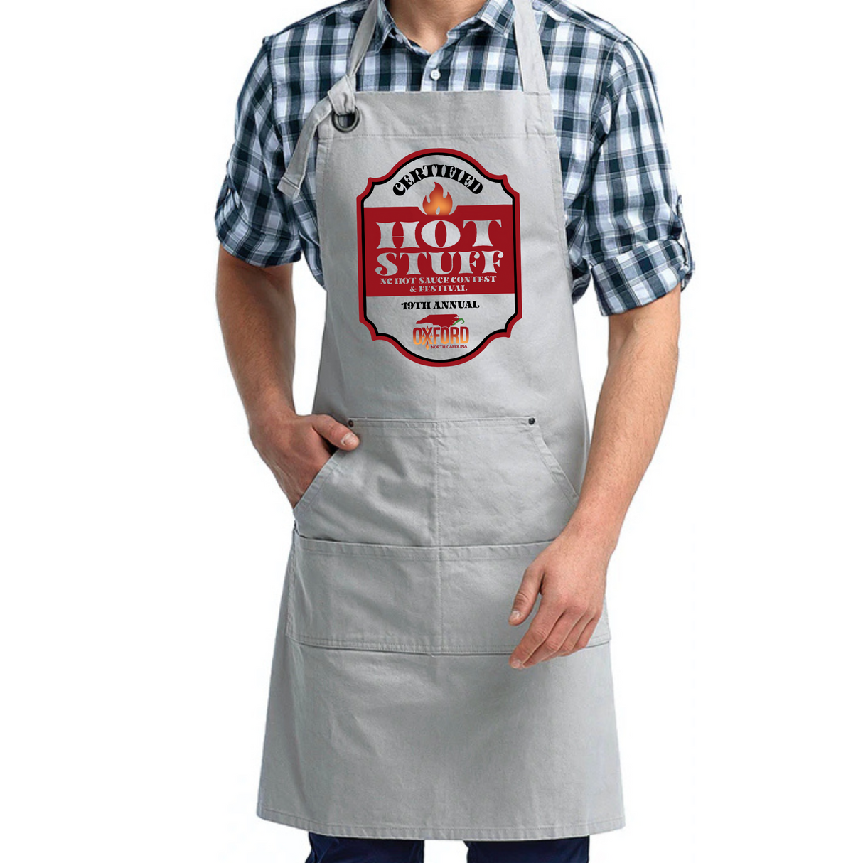 Person wearing a gray apron with a 'Hot Stuff' design on a white background