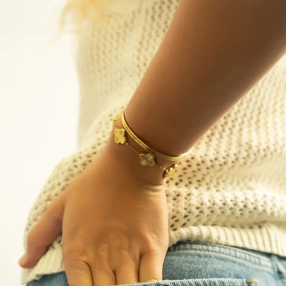 Gold PVD engraved bangle bracelet with "Life is Tough So Are You" sentiment, stylish jewelry from Winks Design Studio.