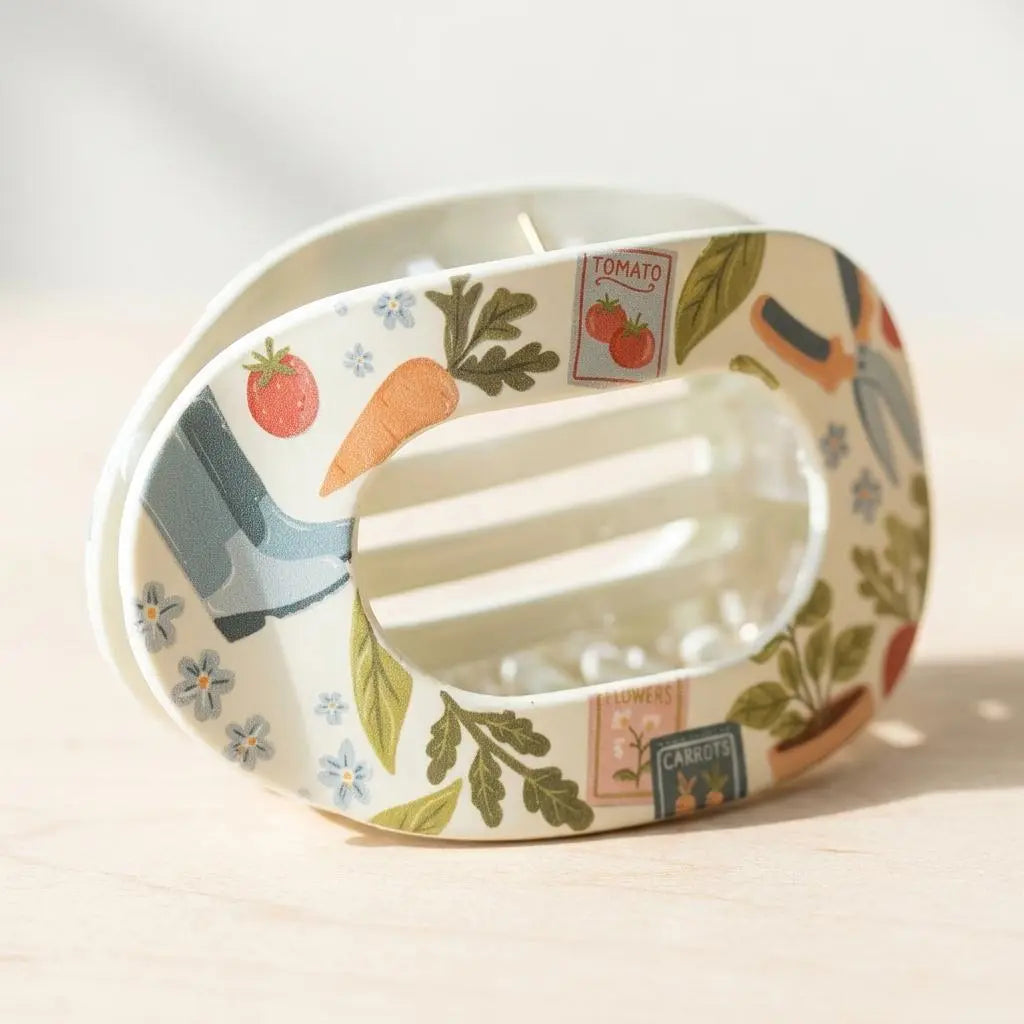Winks Design Studio Garden Essentials claw clip holding hair, made of durable plastic with a sleek, natural finish.