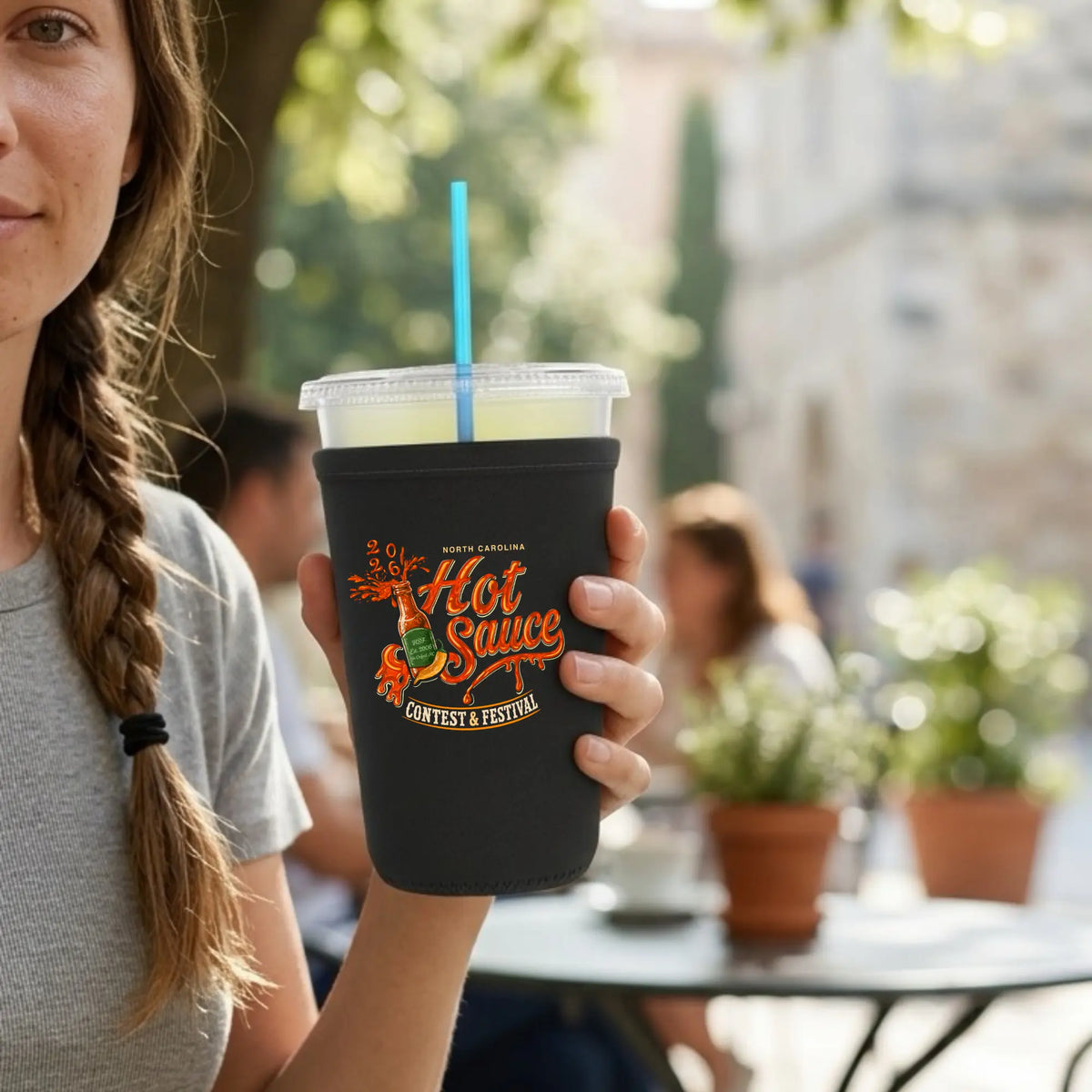 Winks Design Studio NC Hot Sauce Festival neoprene cup sleeve featuring colorful hot sauce bottle design.
