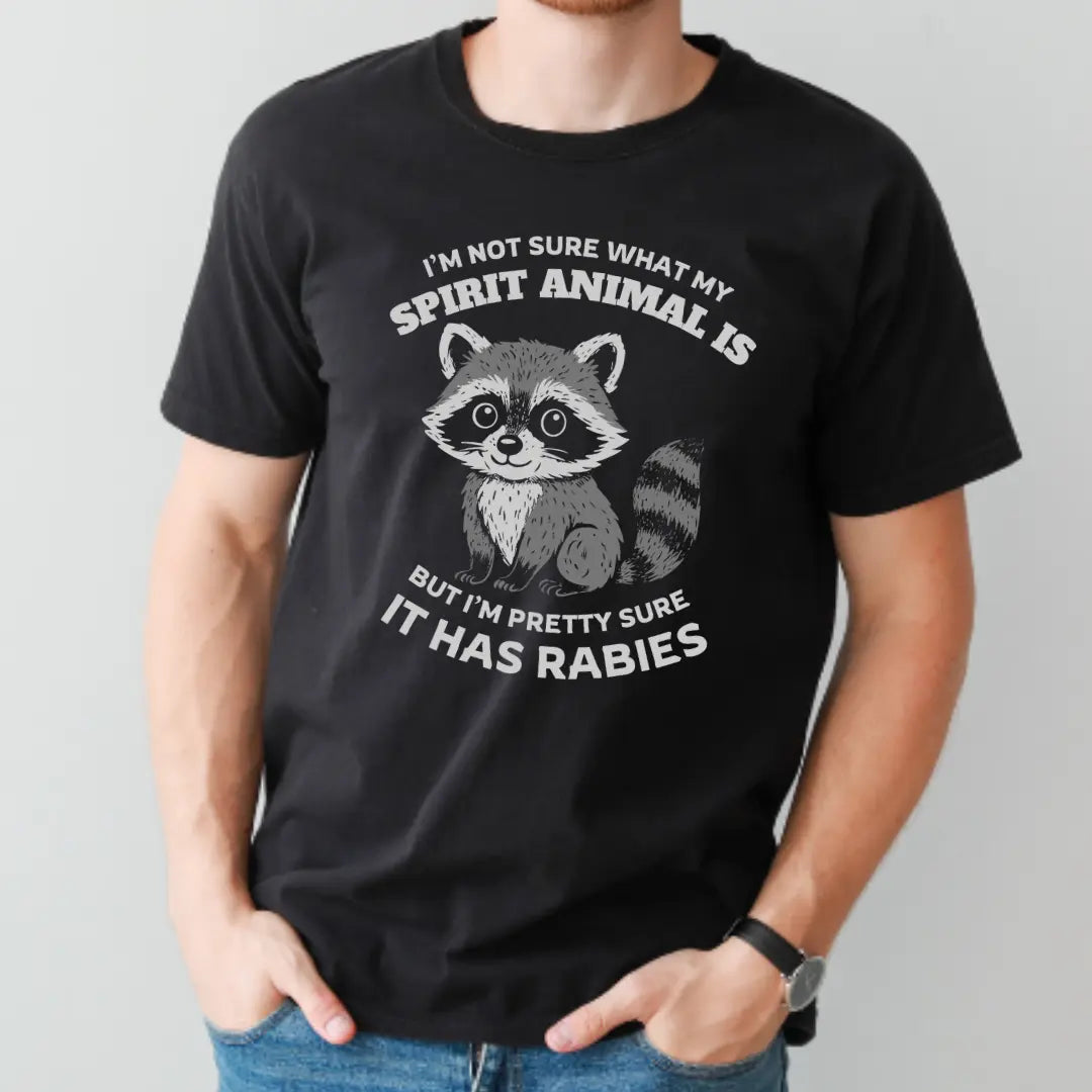 Funny raccoon spirit animal T-shirt by Winks Design Studio, LLC featuring a playful raccoon illustration on a casual T-shirt.