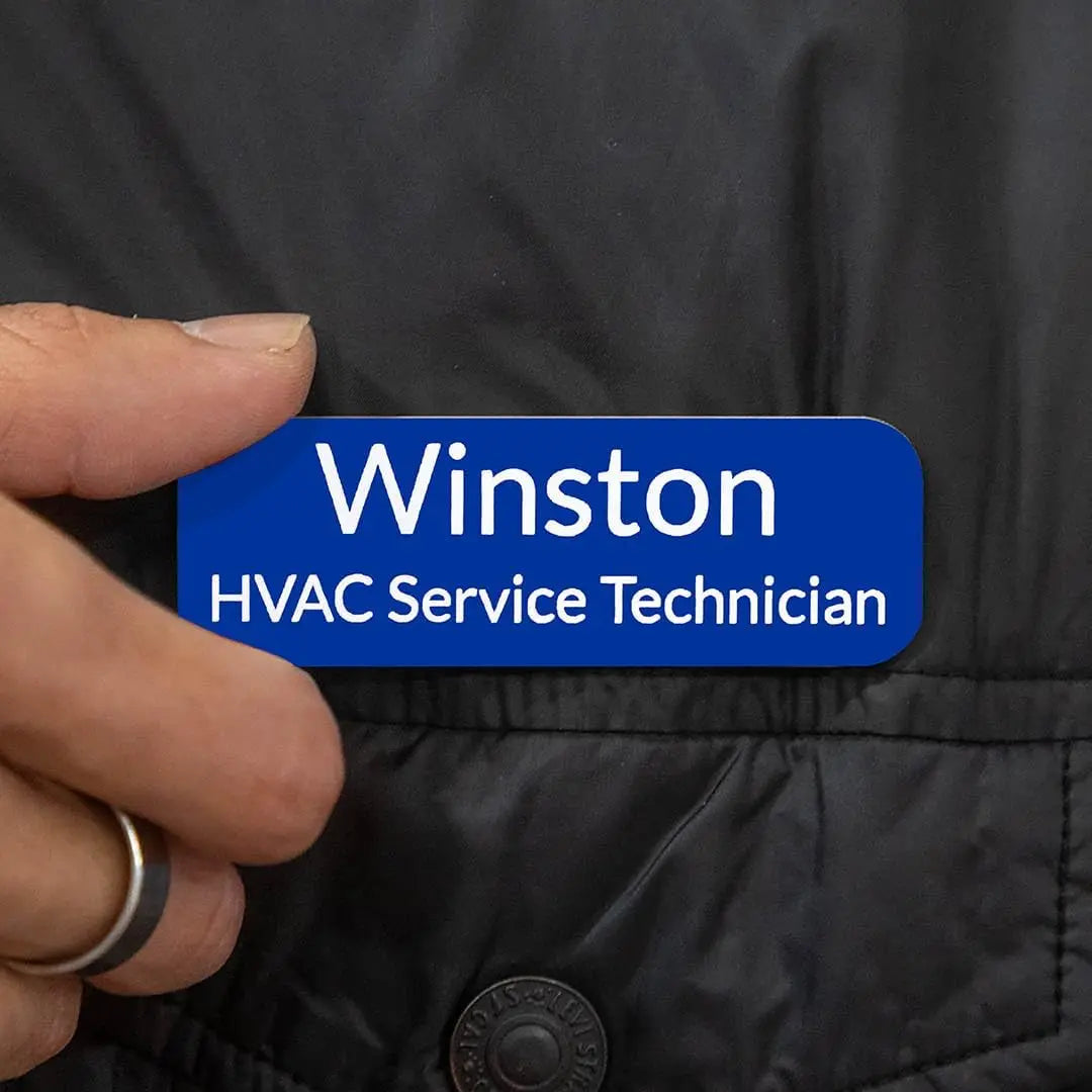 Custom engraved magnetic name badge from Winks Design Studio, LLC featuring a sleek, professional design with personalized text.