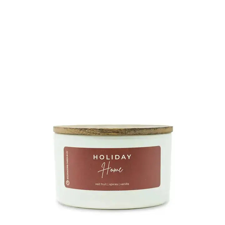Winks Design Studio holiday 10 oz statement candle from Milkhouse Candle Home collection, with festive design and warm glow.