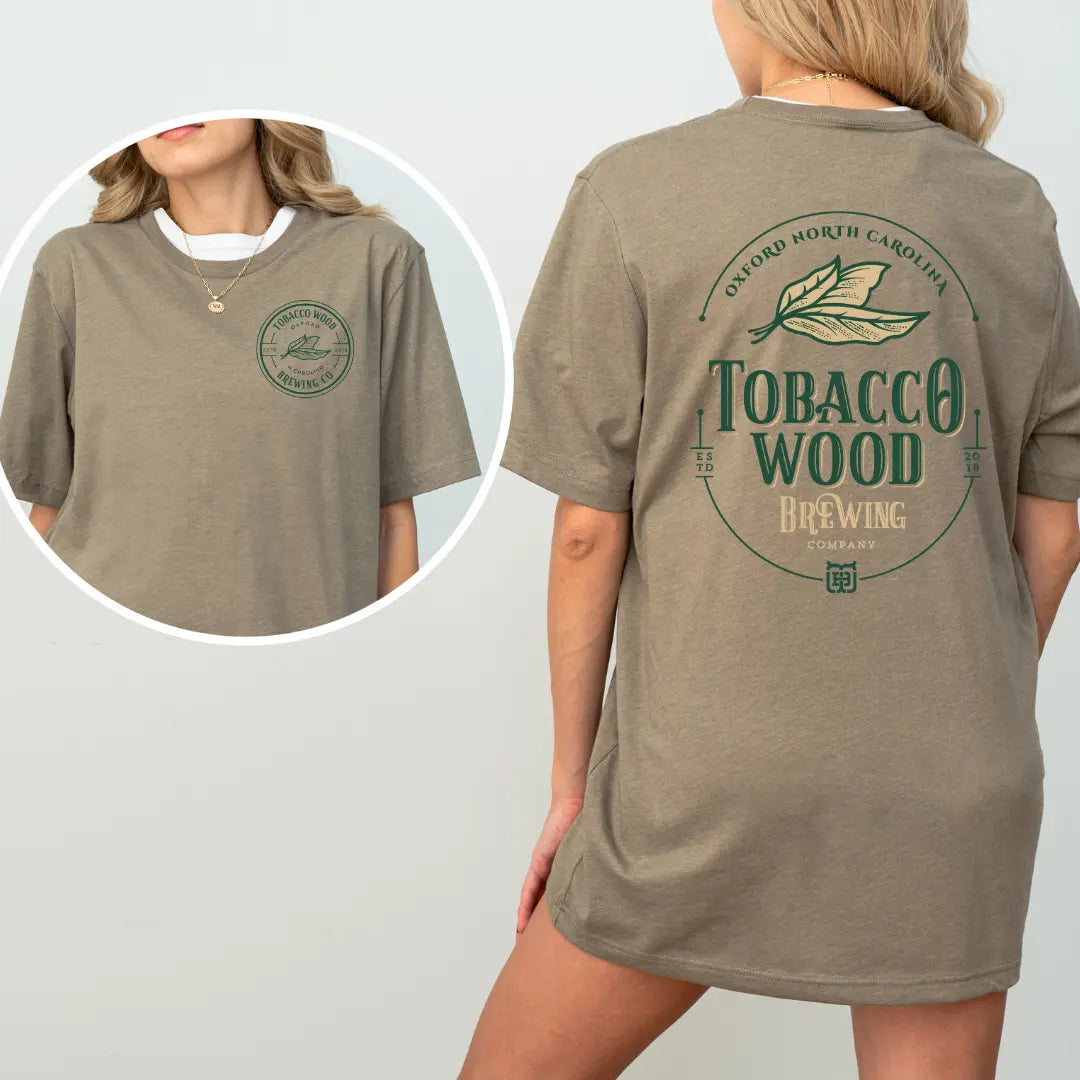 Winks Design Studio tobacco wood brewing pocket and full back T-shirt in black with detailed graphic design.