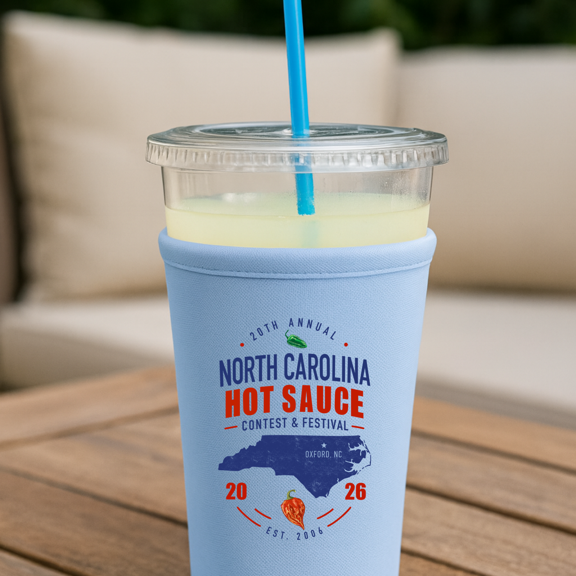 Winks Design Studio Carolina hot sauce neoprene cup sleeve with vibrant festival design and snug fit for beverage cups.