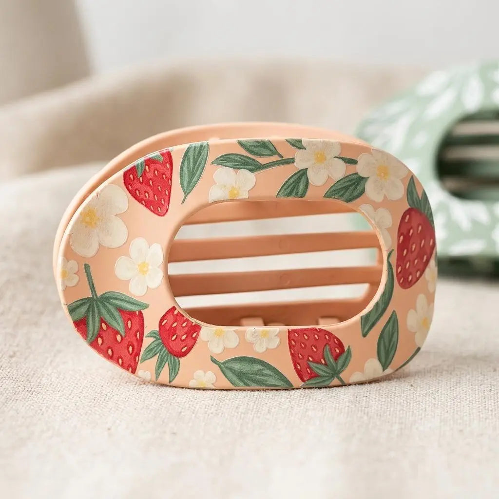 Winks Design Studio LLC Sweet Summer Strawberry claw clip holding hair, featuring a bright red strawberry design for summer style