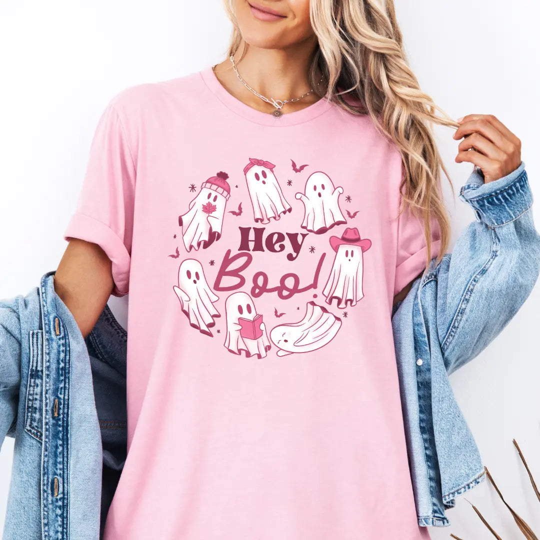 White Halloween ghost T-shirt from Winks Design Studio, LLC featuring spooky ghost graphic and "Hey Boo" text on the front.