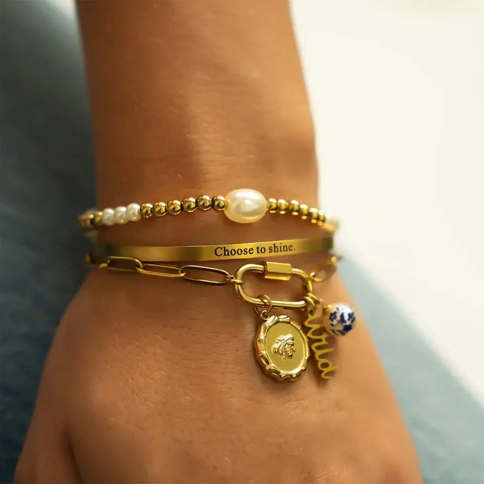 18K gold bee charm pendant with detailed bee design, crafted by Winks Design Studio, LLC, featuring a polished finish.