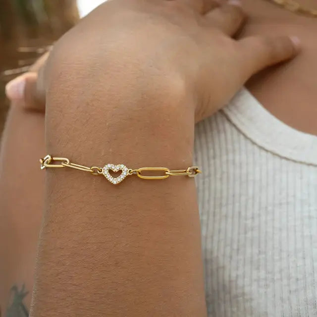 18K gold heart paperclip chain bracelet by Winks Design Studio showing a delicate gold bracelet with heart and paperclip links.