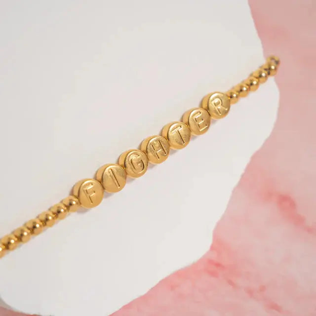 18K gold fighter metal bead bracelet from Winks Design Studio, LLC, featuring a stylish beaded design on a sleek bracelet.
