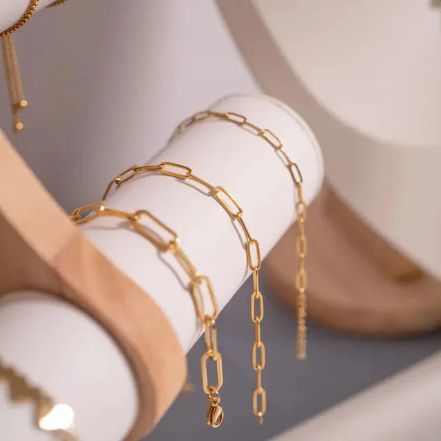 18K gold paperclip chain bracelet by Winks Design Studio featuring sleek, modern links and a polished finish.
