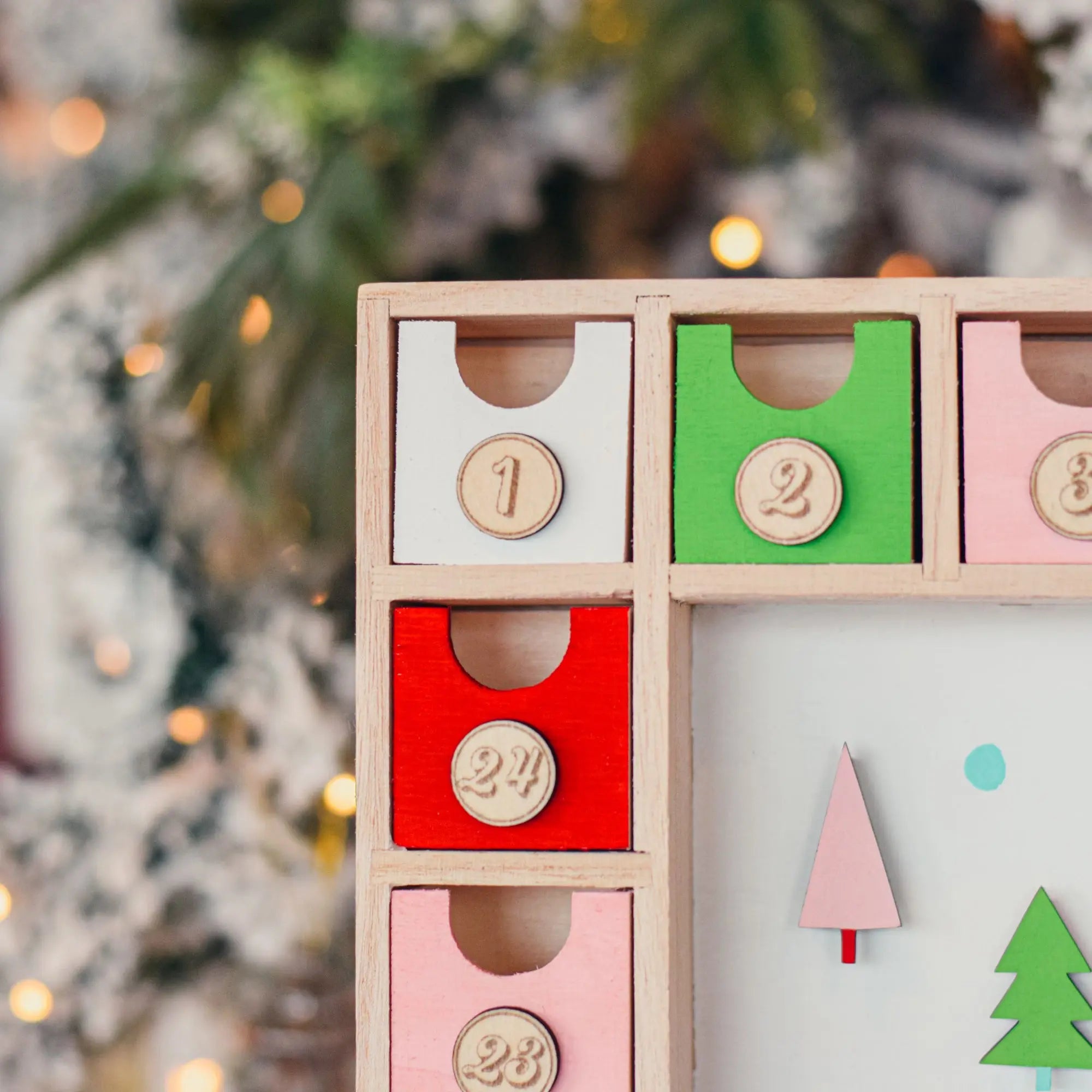 Winks Design Studio Be Merry Advent Calendar with festive holiday design and numbered doors for daily countdown.