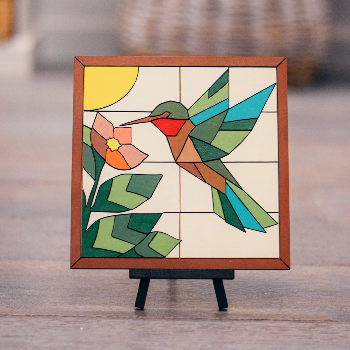 DIY hummingbird wooden mosaic sign kit by Winks Design Studio, LLC, featuring colorful mosaic pieces on a wooden bird-shaped sign.