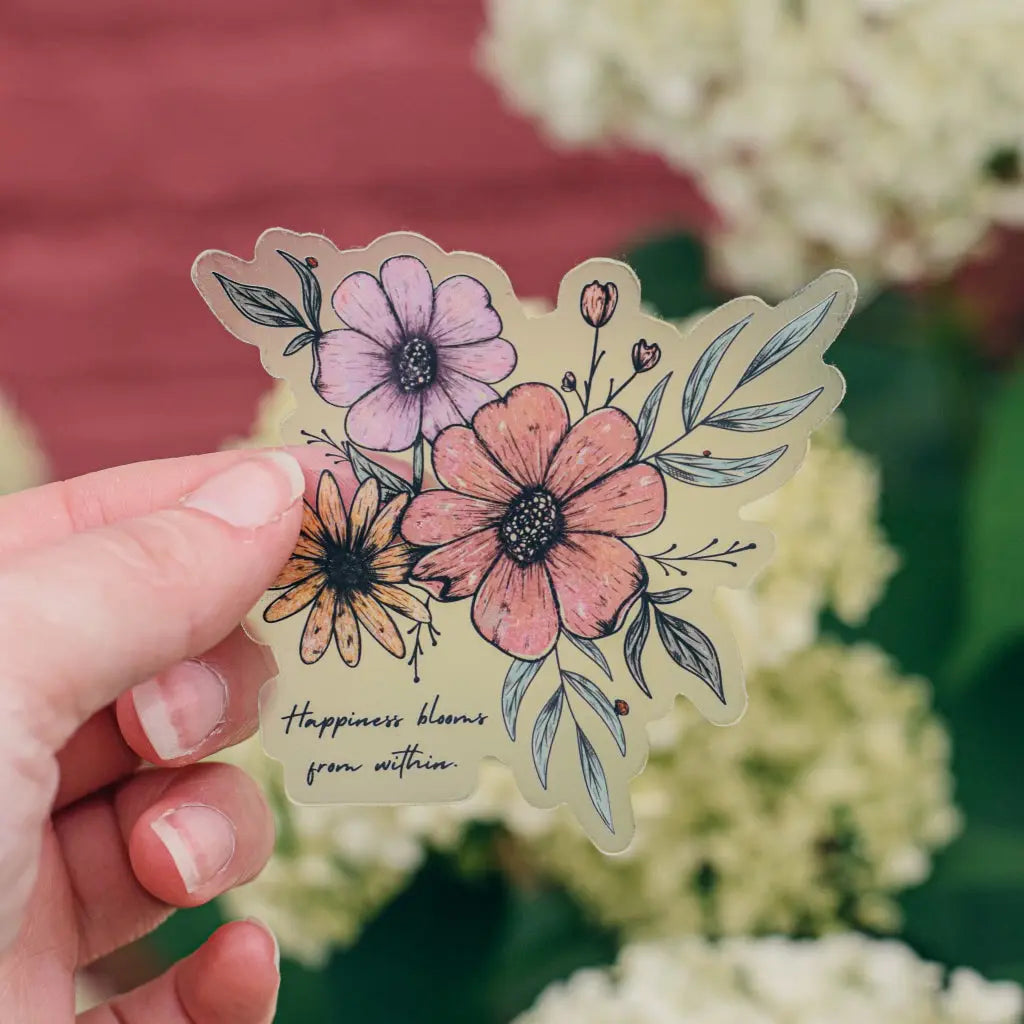 Colorful vinyl sticker featuring floral design with the words "Happiness Blooms from Within" by Winks Design Studio LLC