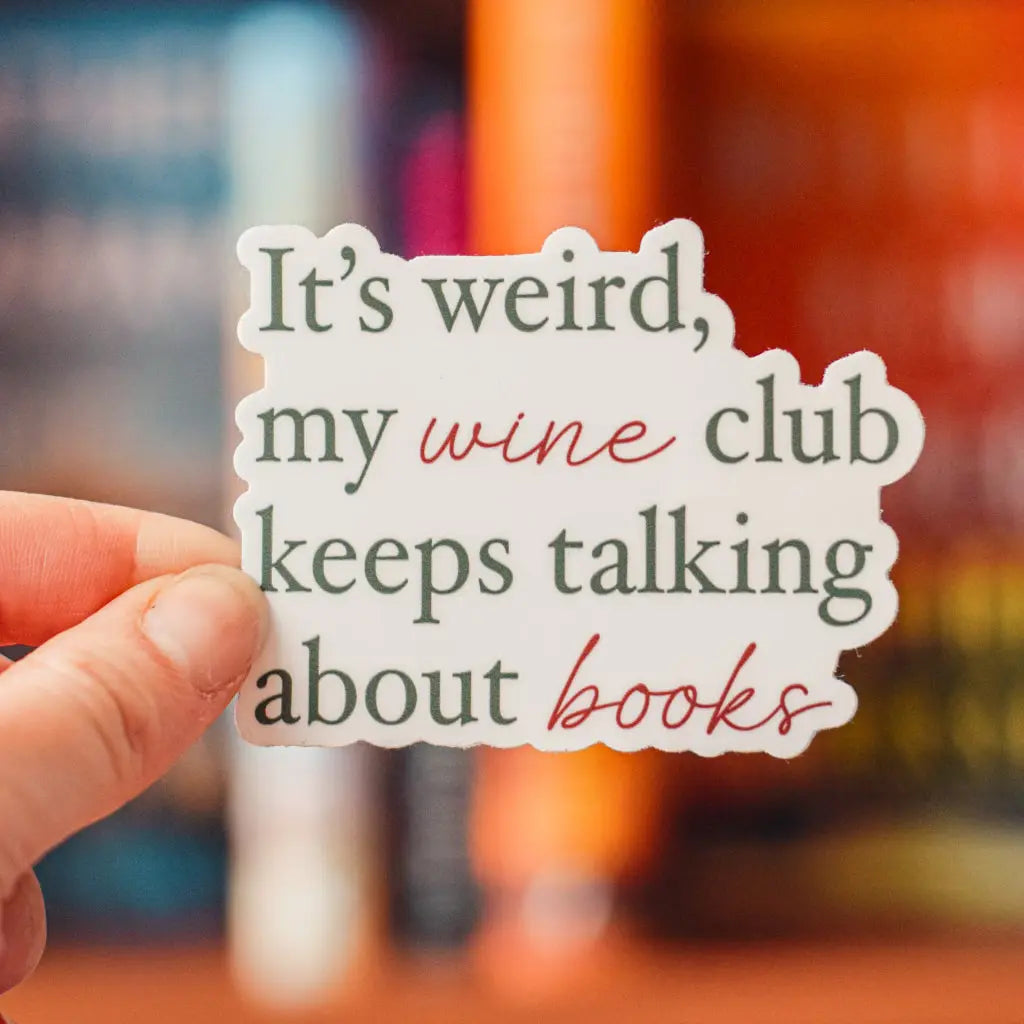 Vinyl sticker featuring "It’s Weird My Wine Club Keeps Talking About Books" design by Winks Design Studio, LLC.