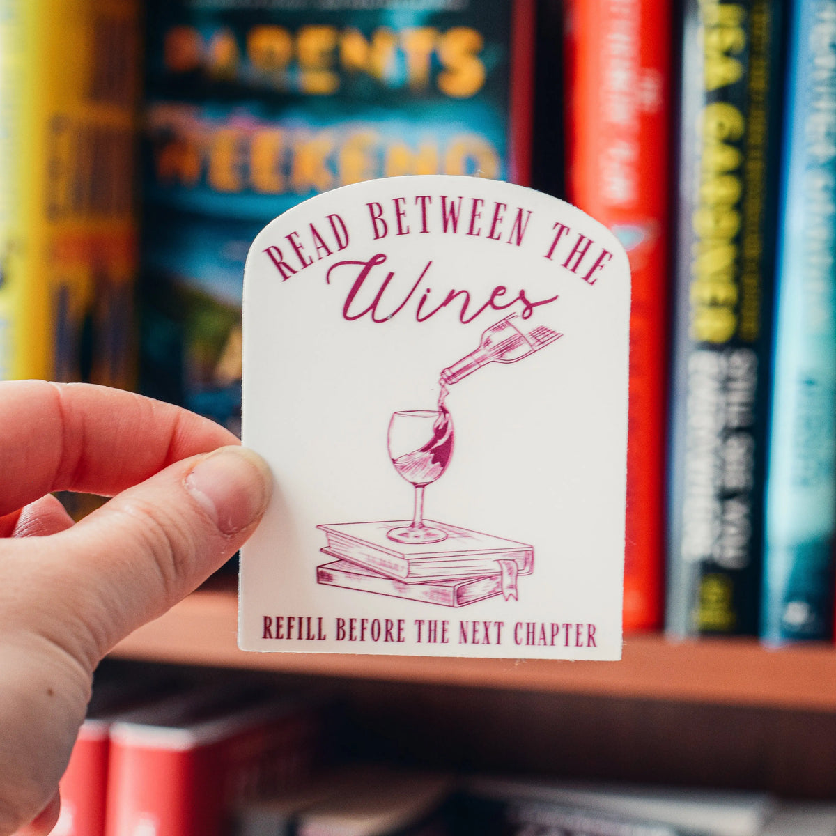 Read Between the Wines sticker by Winks Design Studio, LLC, featuring a colorful wine-themed design on a adhesive sticker.