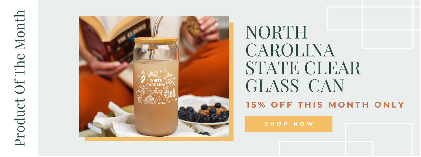 Clear glass can with a product of the month banner and promotional text.