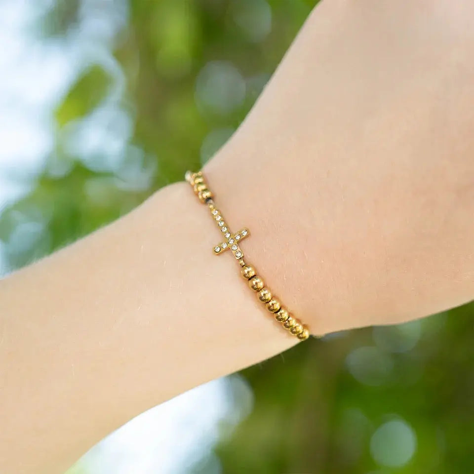 18K gold PVD beaded stretch bracelet by Winks Design Studio, LLC featuring a sleek, elegant design with round beaded details.