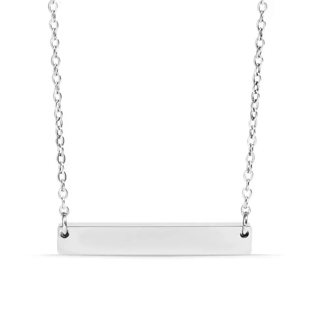 Silver 18K gold engraved bar necklace from Winks Design Studio, LLC featuring personalized stainless steel jewelry.