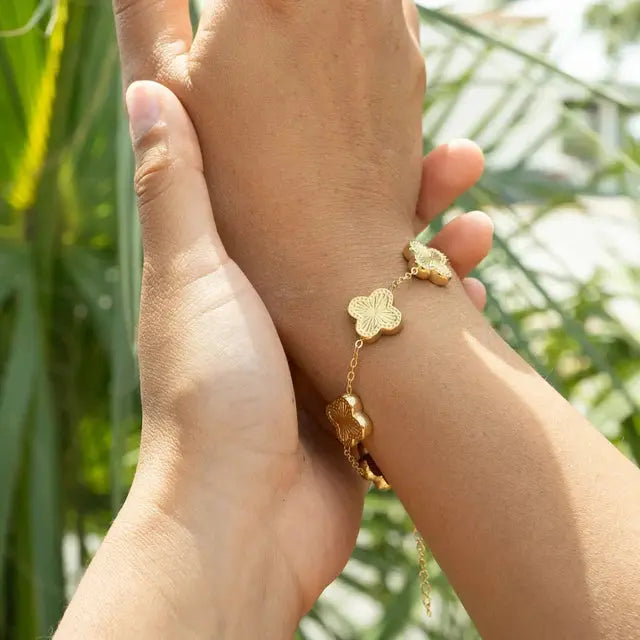 Gold Lucky Clover Charm Bracelet with four-leaf clover charms, 18K gold, from Winks Design Studio, LLC.