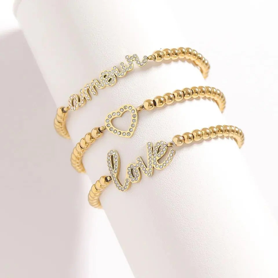 Love beaded stretch bracelet with 18K gold stainless steel beads, designed by Winks Design Studio, LLC.