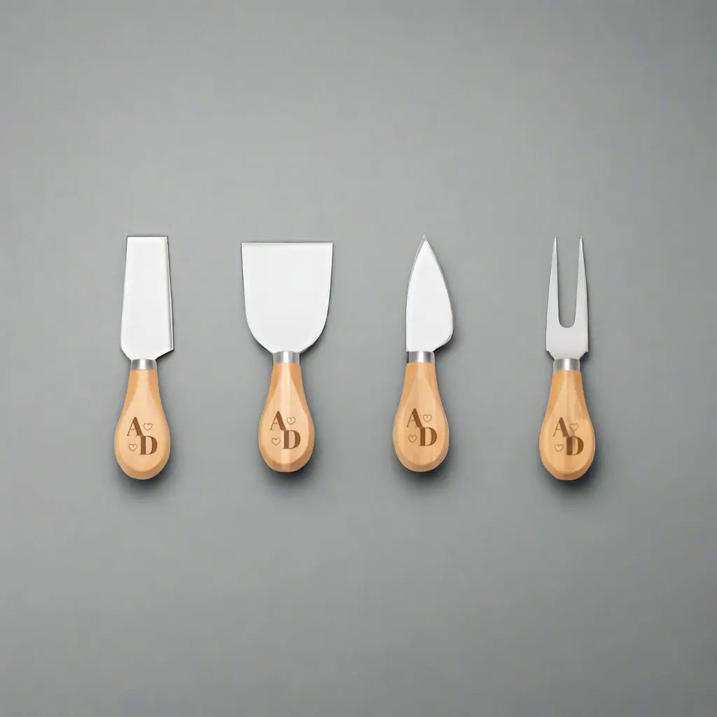 Square engraved bamboo cheese board with utensils from Winks Design Studio, LLC, perfect for serving cheese and appetizers.