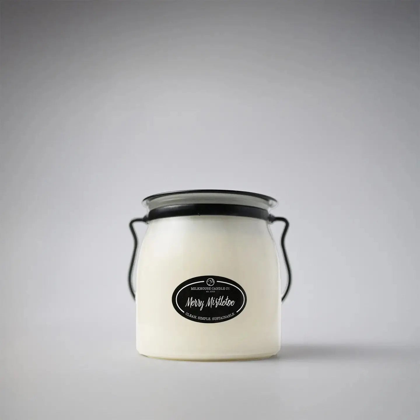 Winks Design Studio Merry Mistletoe 16 oz butter jar candle with festive mistletoe design and warm holiday scent