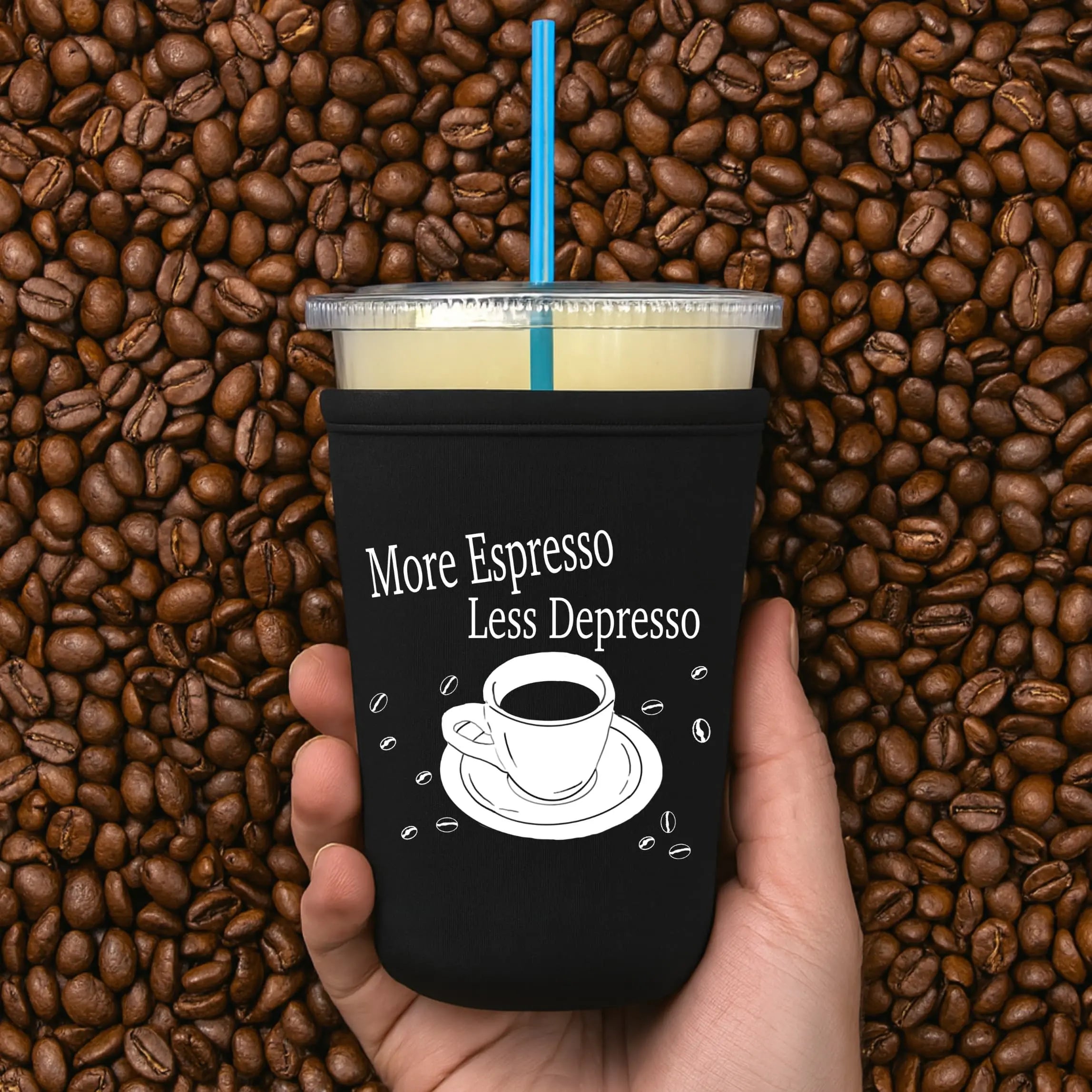 Winks Design Studio espresso cup sleeve with "More Espresso Less Depresso" text, designed to protect hands from hot beverages.